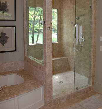 bathroom remodel using natural stone tile and a window in the shower