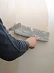 professional worker spackling a wall