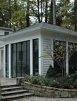 sunroom with natural brick wall and steps